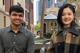 Bhavya Bagaria and Jinru Sun sit beside a water feature on campus at RMIT