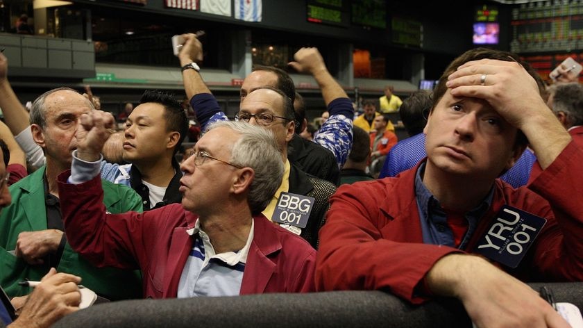 Disappointed share investors on a trading floor.