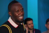 Usain Bolt speaking to media on the Gold Coast