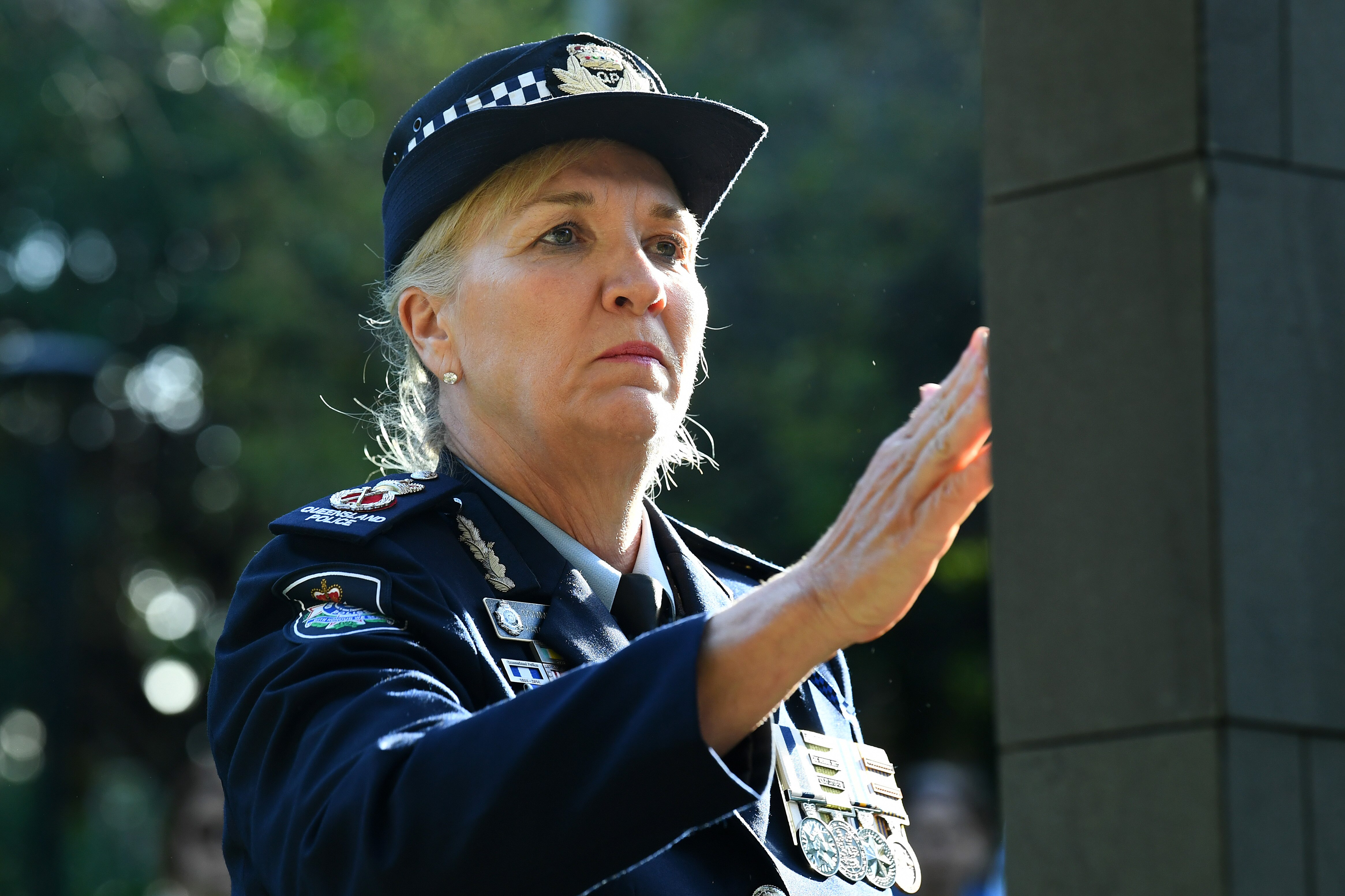 carroll touches the memorial for murdered officers