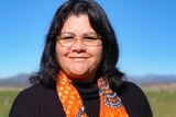 Woman wearing Indigenous scarf
