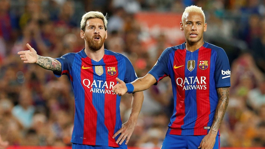 Barcelona's Lionel Messi and Neymar argue with the referee against Alaves