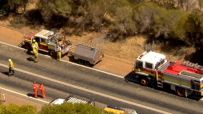 Emergency services workers at Brookton Highway fatal crash scene