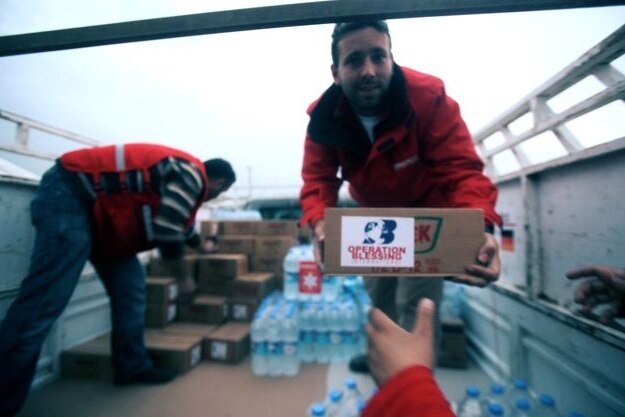 Aid workers unload water in Turkey