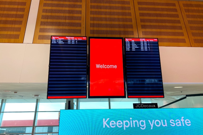 A near-empty arrivals and departures sign at Sydney Airport, with three flights listed under 'departures'.