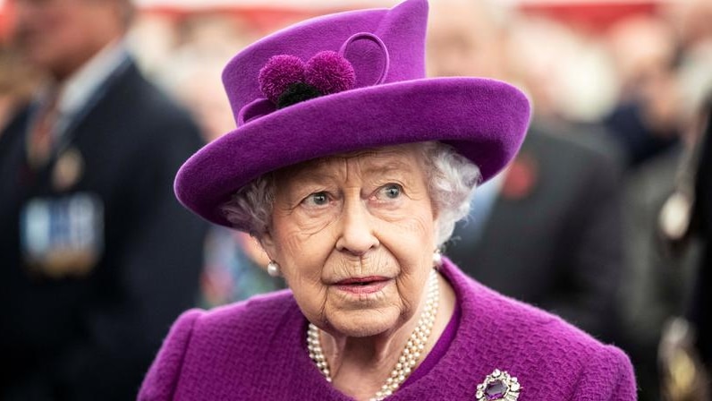 Britain's Queen Elizabeth II wearing a pink costum and hat.