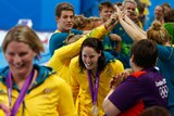 Australia's Olympic team members celebrate with women's relay team after the claimed silver.