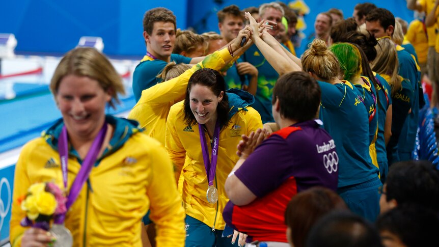 Australia's Olympic team members celebrate with Emily Seebohm, Leisel Jones (L), Alicia Coutts (C) and Melanie Schlanger.