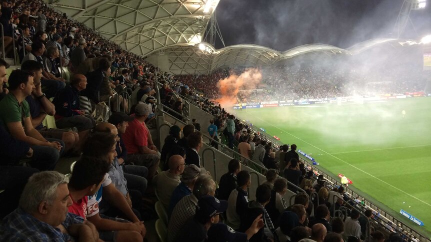 Fans set off flares at Melbourne Victory's match with Western Sydney Wanderers at AAMI Park.