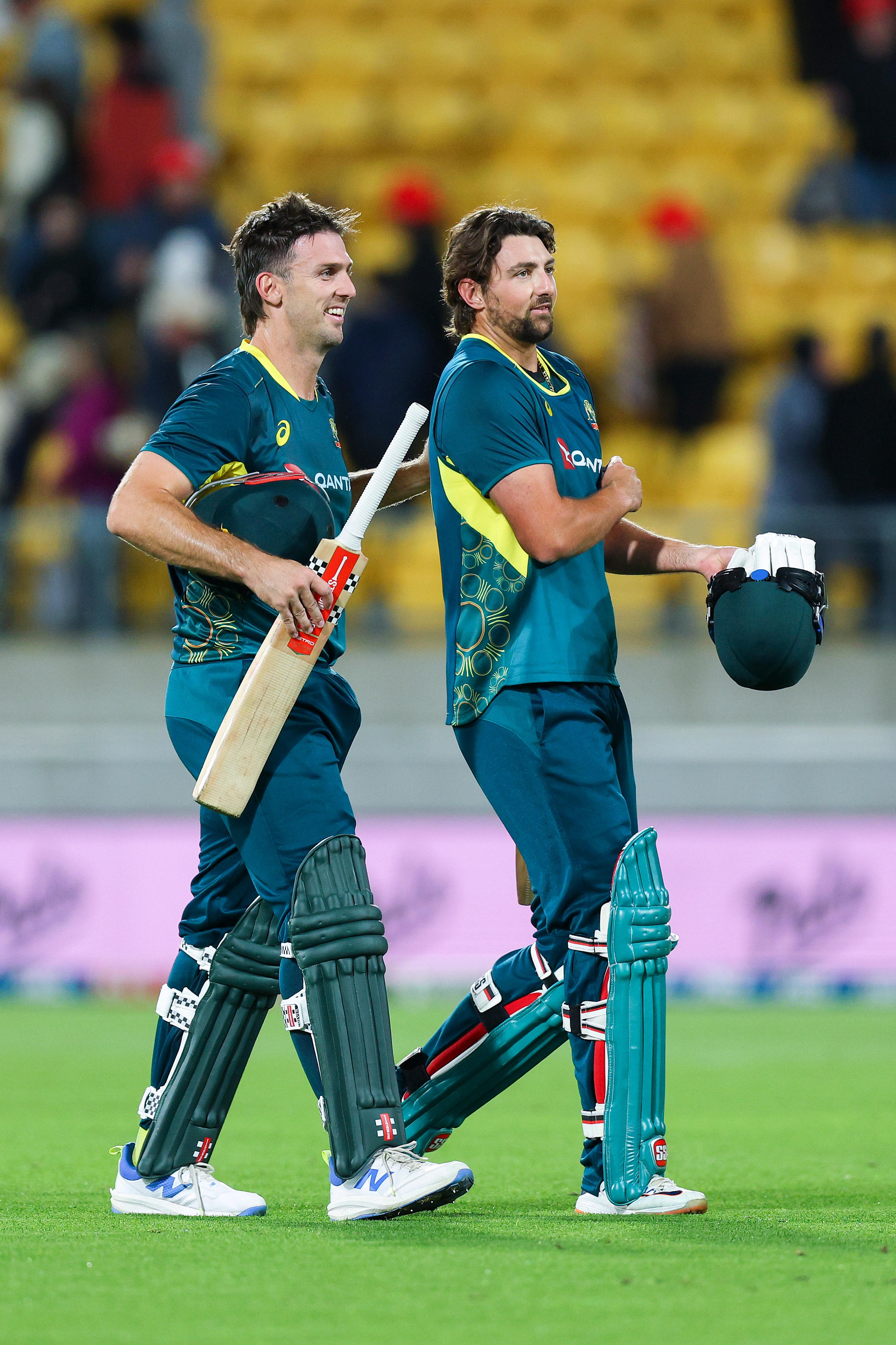 Two men celebrate after winning a cricket match