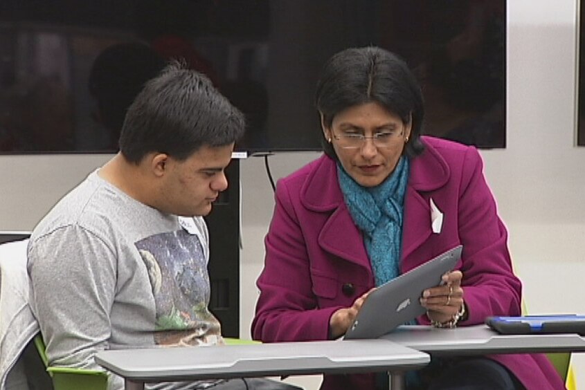 Mother and son Ami and Paul Iacuone learn how to use iPads during a program at the Digital Hub at the Gungahlin Library.