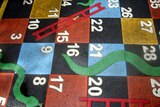 A generic image of the snakes and ladders board game