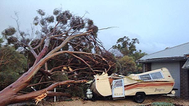 Storm damage to a caravan and house