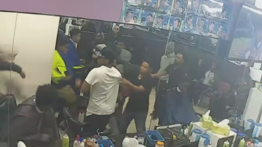 A CCTV still of youths brawling in a barber shop in Footscray.