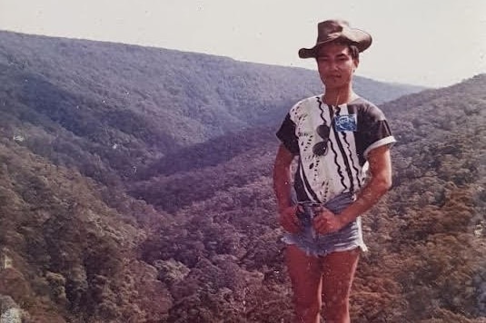 Archival image of a man in the Australian bush in a cowhide hat.