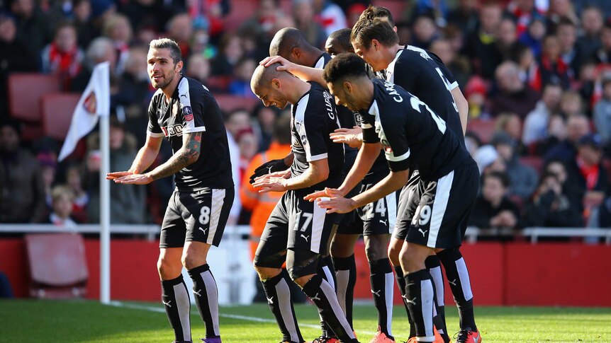 Watford's Adlene Guedioura (17) celebrates with team-mates after his FA Cup goal against Arsenal.