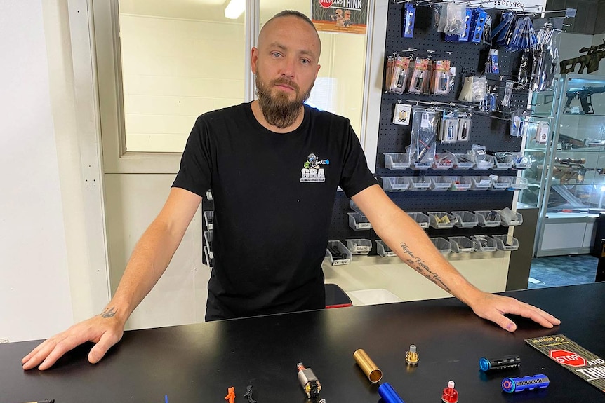 Importer and retailer Daniel Hennessy stands behind the counter at his gel ball blaster shop in Brisbane on January 15, 2021.