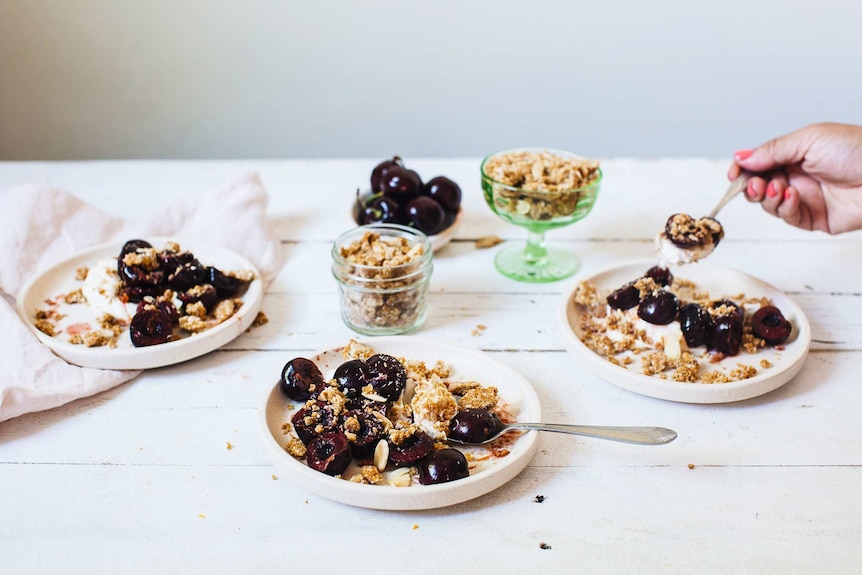 Whipped mascarpone and yoghurt topped with orange cherries and Anzac biscuit crumble for an easy Christmas dessert recipe.