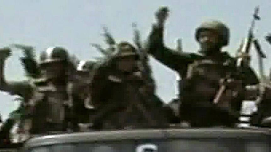TV image of Syrian troops arriving in the flashpoint town of Jisr al-Shughur