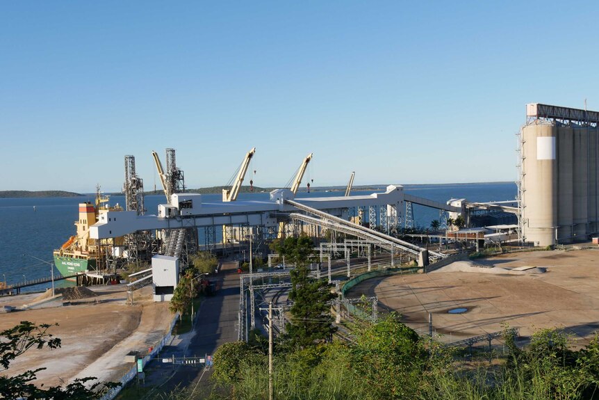 Silos and infrastructure loading grain onto a ship