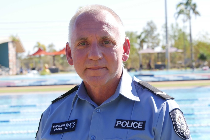 A police officer at a local pool.