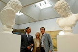 Guido, Amina and Luca Belgiorno-Nettis look at two sculptures at the Art Gallery of NSW.