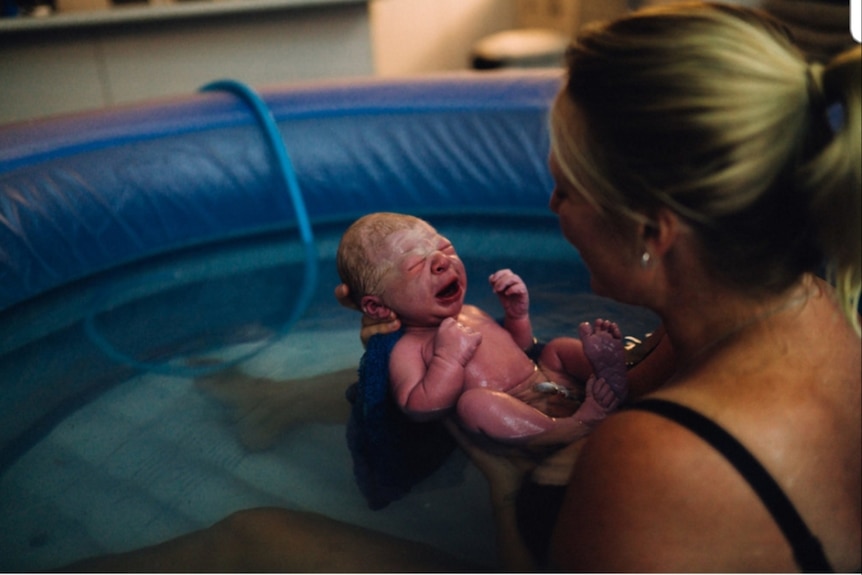 Baby born at home in inflatable pool