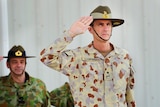 Major General Angus Campbell accepts a salute during the transition parade at Al Minhad Airbase, United Arab Emirates.