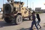 Residents who are angry over the US withdrawal from Syria hurl potatoes at American military vehicles in the town of Qamishli.
