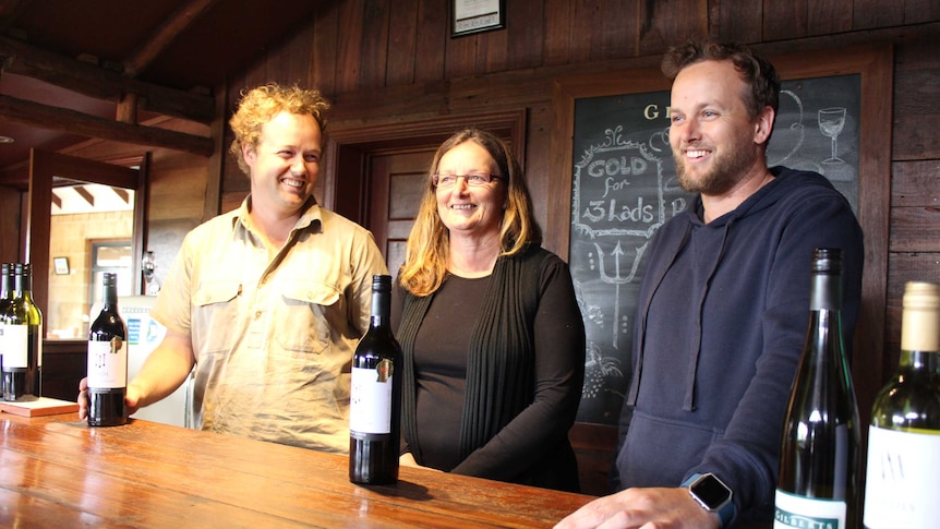 Matthew, Beverly and Clinton Gilbert with their award winning wine.