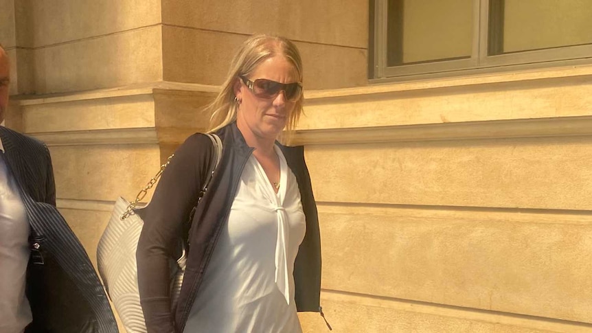 Carly Jane Wren walking outside court