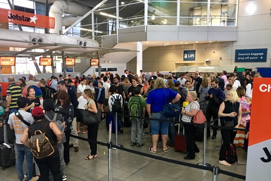 Long queues at Sydney Airport after a severe thunderstorm forced delays.