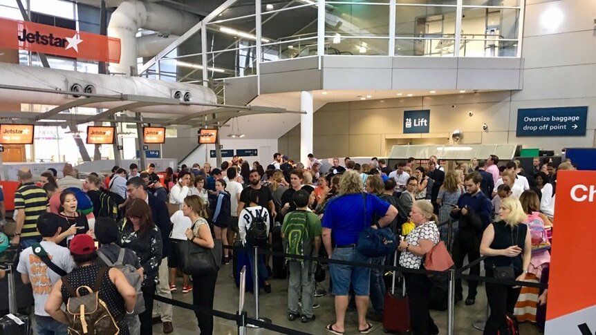 Long queues at Sydney Airport after a severe thunderstorm forced delays.
