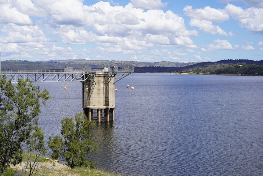 A large body of water in a rural landscape