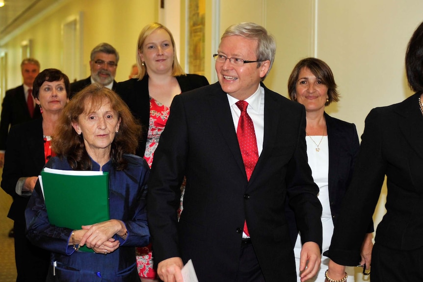 Kevin Rudd leaves with supporters after losing the Labor leadership challenge