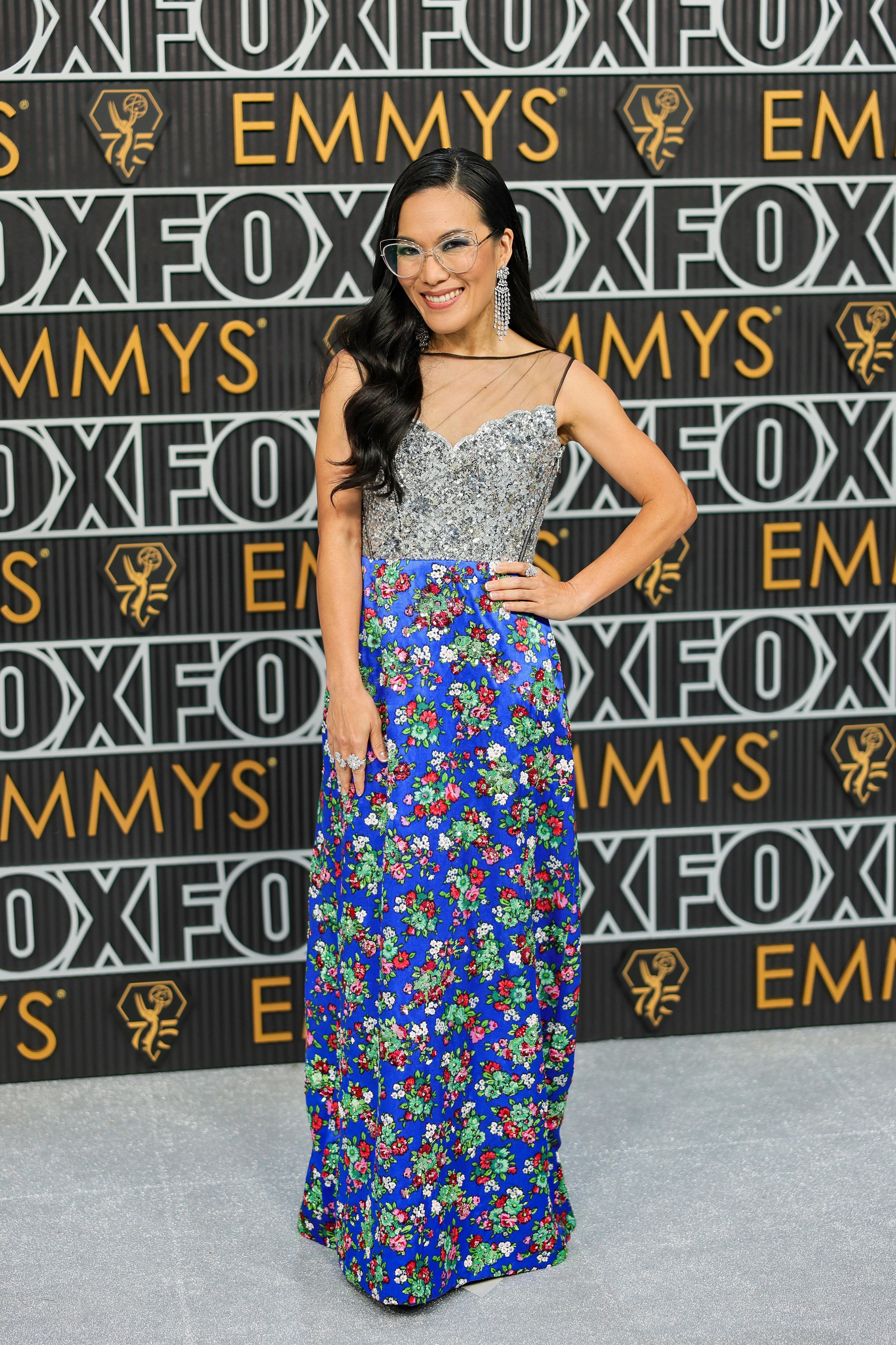 A woman in a blue and silver dress on the red carpet