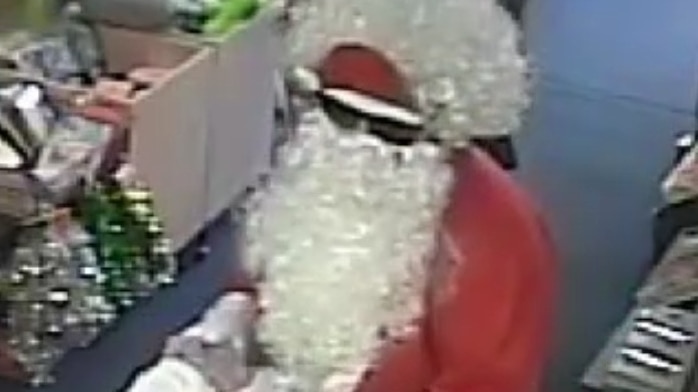 A man in a Santa Clause suit robs a Melbourne post office.