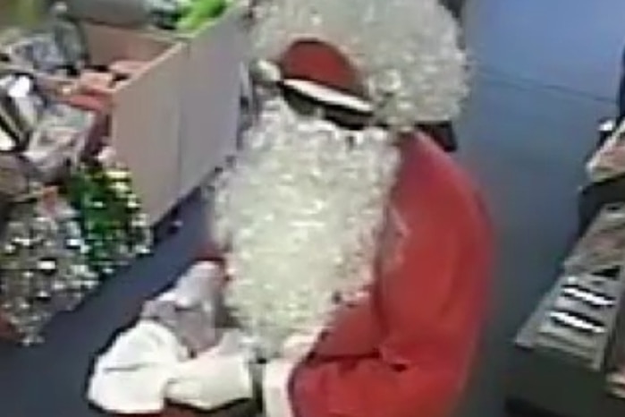 A man in a Santa Clause suit robs a Melbourne post office.