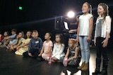 Children on stage during an audition.