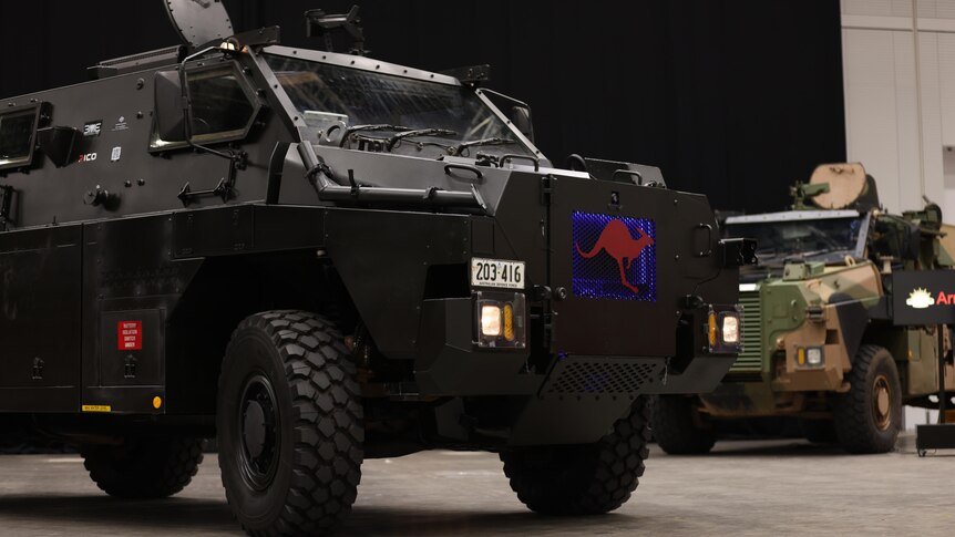 a combat vehicle on a showroom