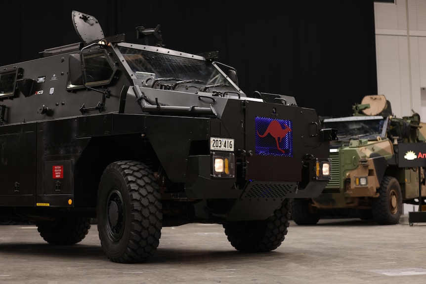 a combat vehicle on a showroom