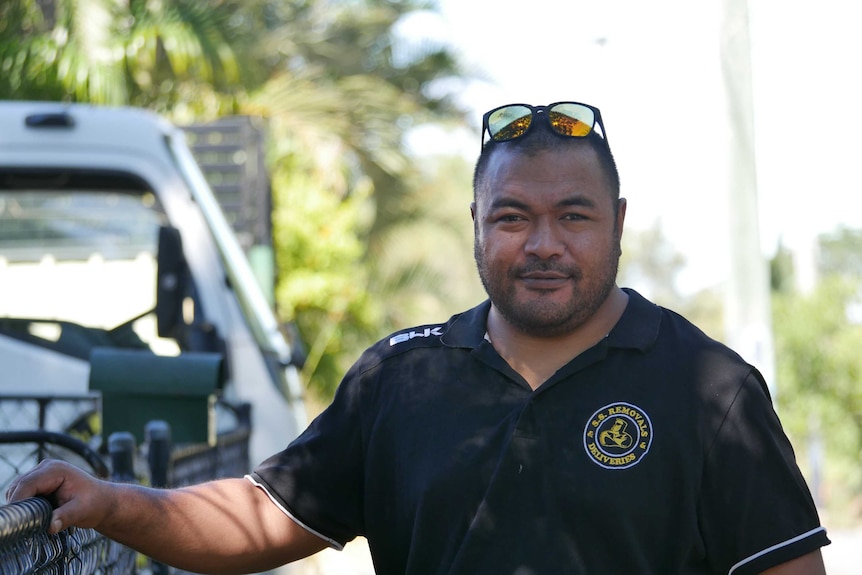Removalist John Siaki stands in front of his truck.