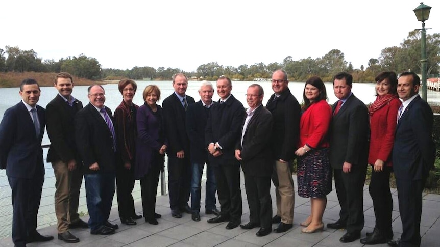 MPs pose for a photo near the River Murray during a visit to Renmark for a country meeting of Cabinet.
