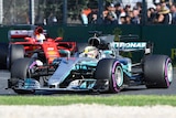 Lewis Hamilton's Mercedes ahead of Sebastian Vettel's Ferrari