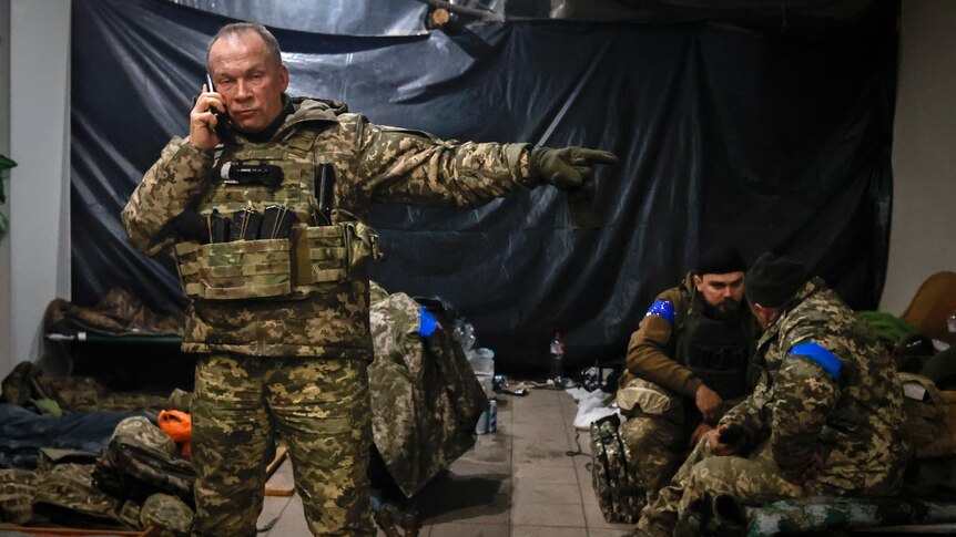 Commander of the Ukrainian army, Col. Gen. Oleksandr Syrskyi, gives instructions in a shelter in Soledar.