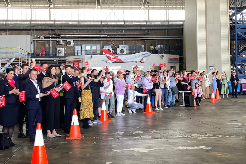 People greet the arrival of the Qantas A380