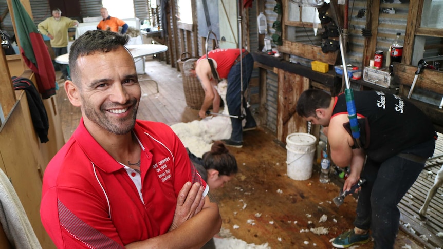 Roger Pearse stands in shearing shed