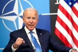US President Joe Biden speaks during a NATO meeting