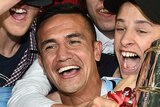 Tim Cahill celebrates with FFA Cup trophy with fans