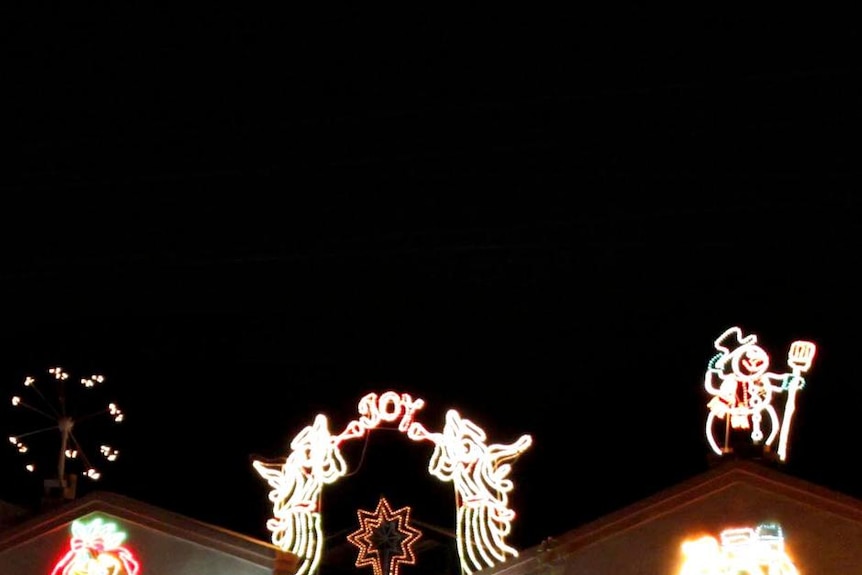 A house lit up with Christmas lights.